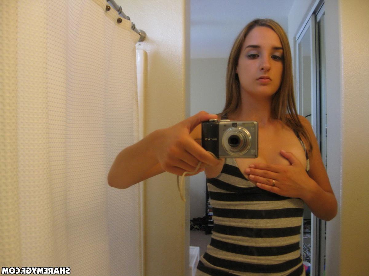 12P Cute girlfriend shows off her perky tits and round ass as she takes selfshot mirror pictures