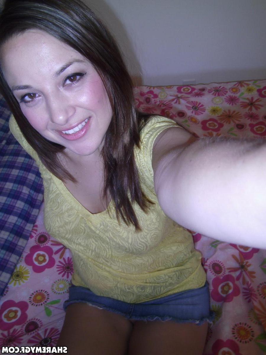 20P Hot brunette amateur takes selfies of her wet pussy