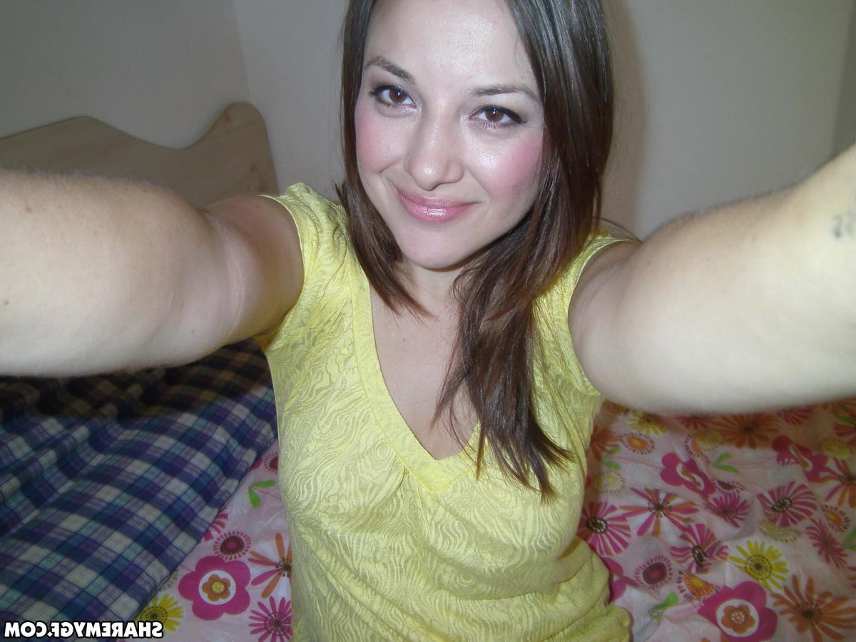 20P Hot brunette amateur takes selfies of her wet pussy