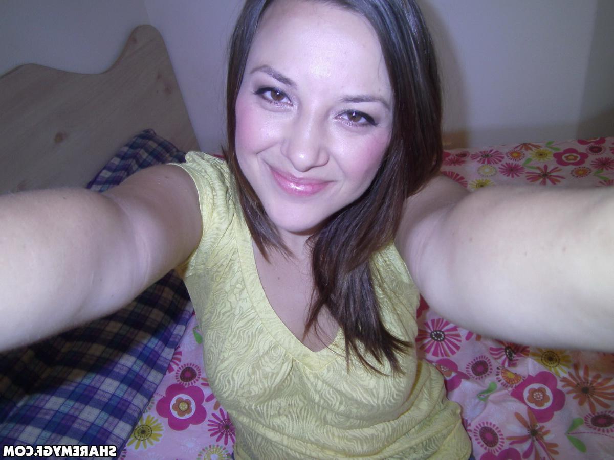 20P Hot brunette amateur takes selfies of her wet pussy