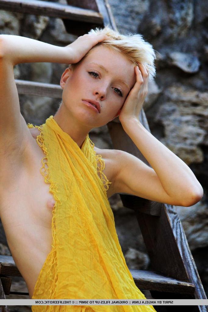 16P Short-haired blonde model Spirit displays her skinny body outside