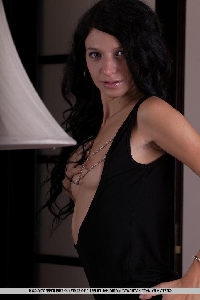 16P Black haired pinup model Greta plays with her hairy pussy