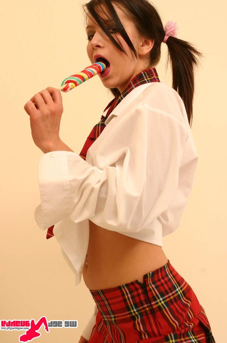 15P Pictures of a schoolgirl licking a lolipop