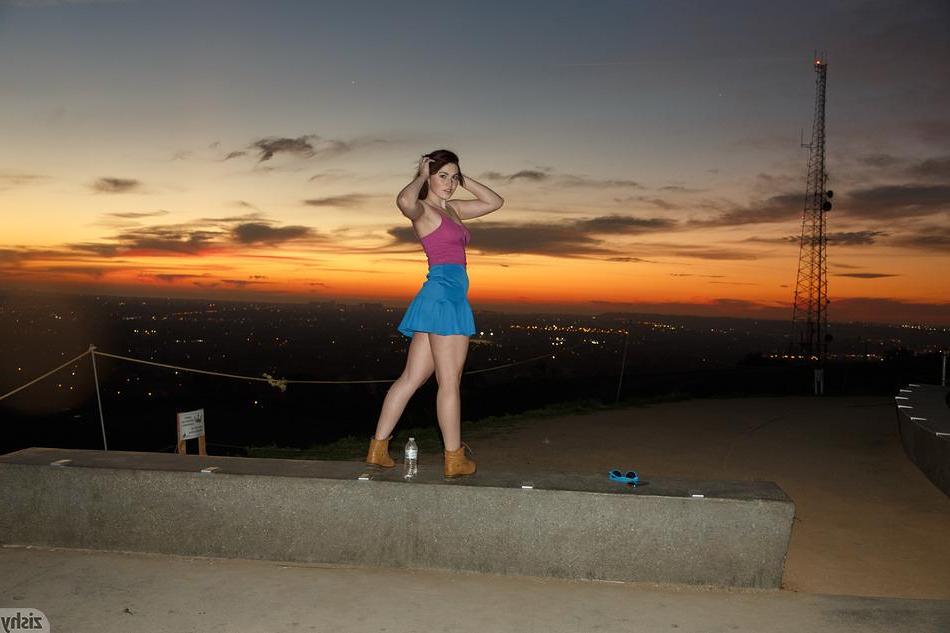8P Brunette coed Tori Segura shows you what's up her skirt outside