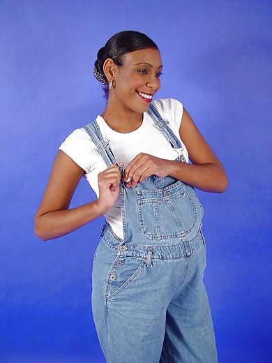 25P Pregnant black woman showing off