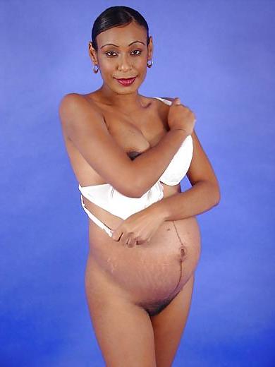 25P Pregnant black woman showing off