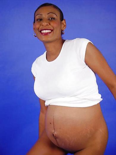 25P Pregnant black woman showing off