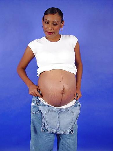 25P Pregnant black woman showing off