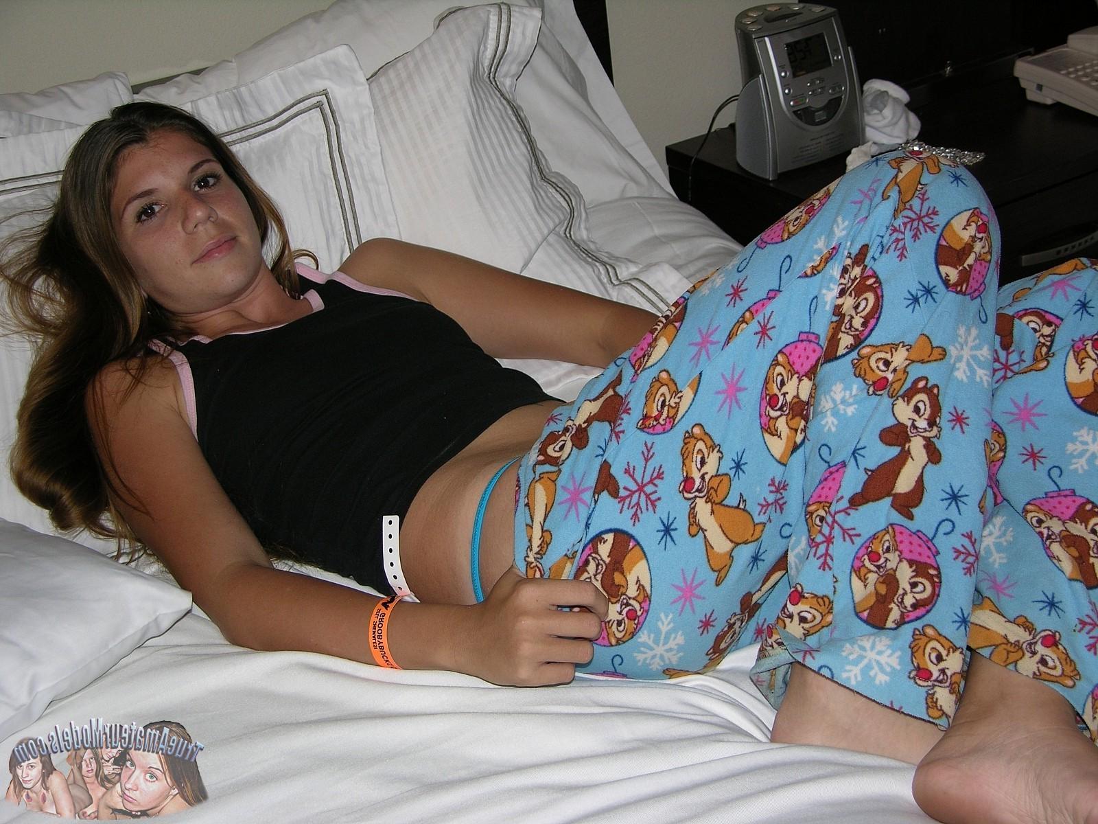 17P Hot Brunette Teen Strips down cartoon pajamas and shows hairy bush