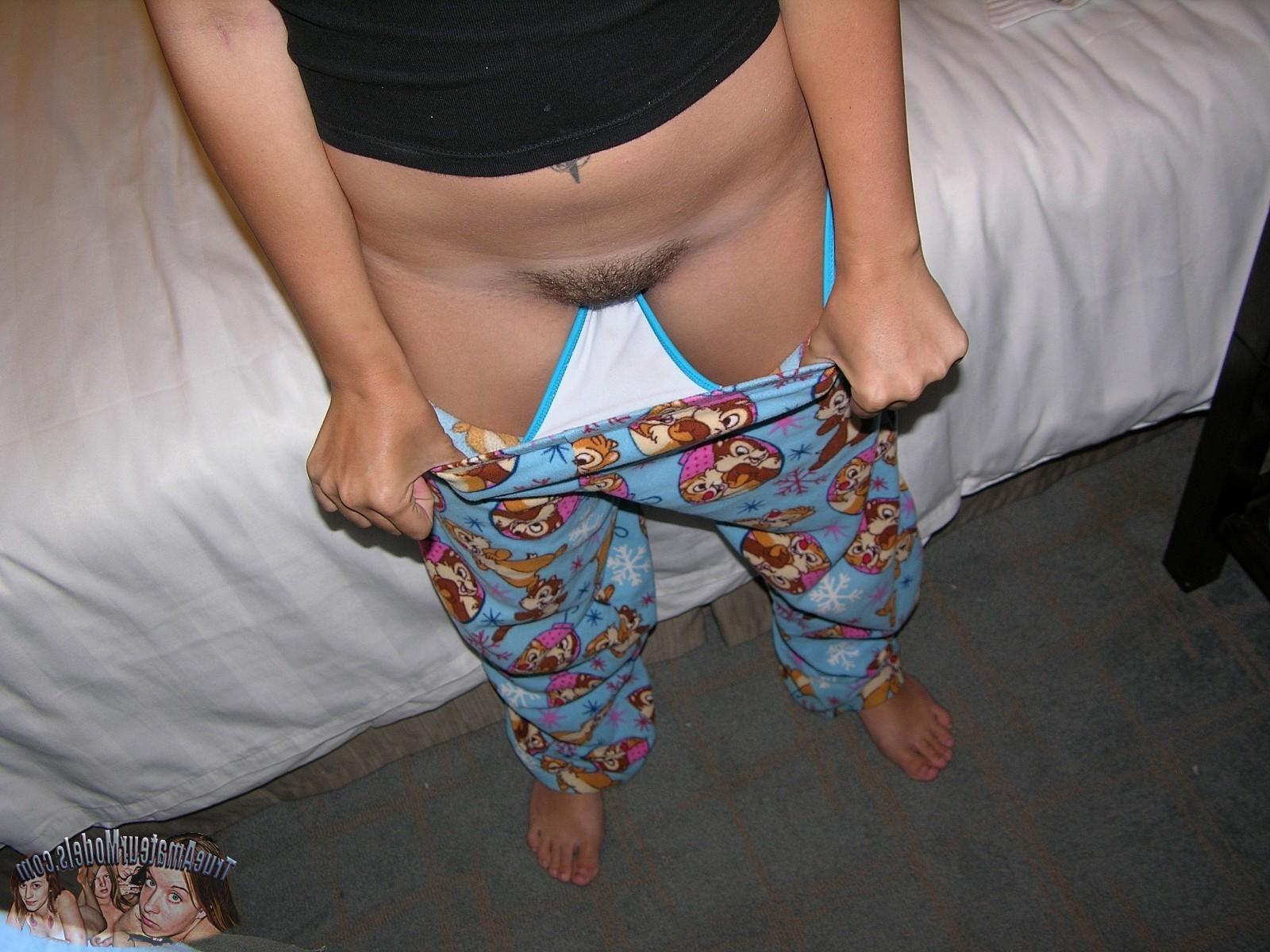 17P Hot Brunette Teen Strips down cartoon pajamas and shows hairy bush