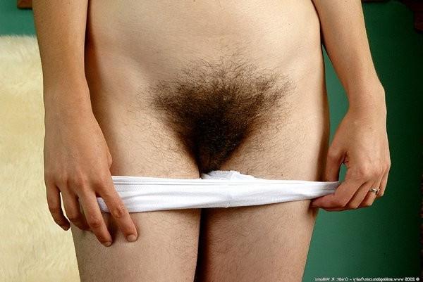 15P coed strips of her undies and exposes a super hairy pussy