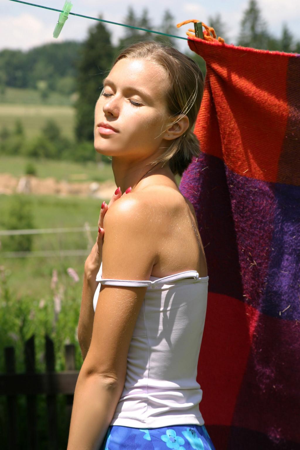 15P Young amateur shows her small tits