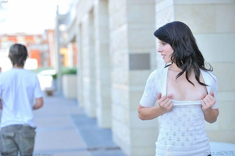 15P Long legged brunette outdoor in short skirt no panties