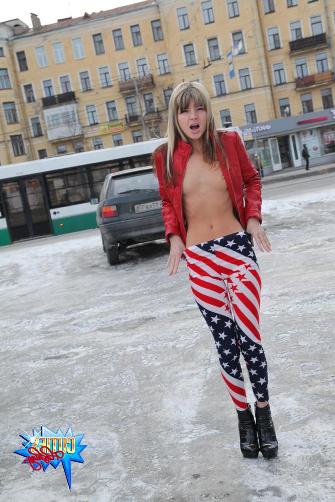 16P Posing on city streets with her tiny booty bare