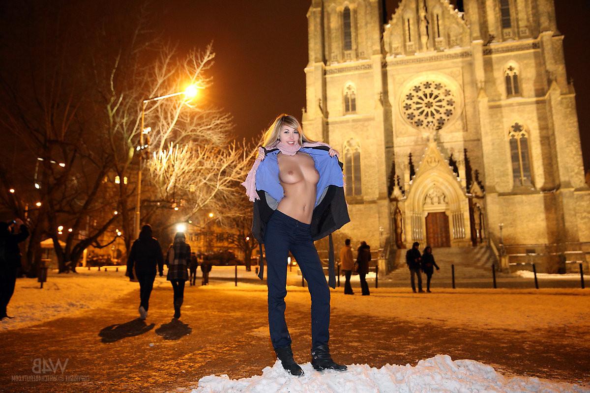16P The snow is cold on her hard nipples as this cutie flashes her tits and pussy ou