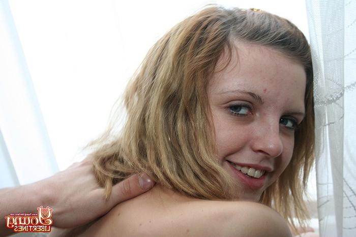 16P Naughty girl looks outside the window while naked before sex