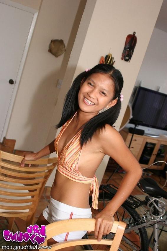 16P Kat Young Strips her top and tight white shorts