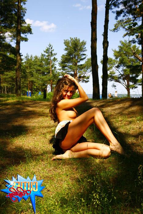 16P Gorgeous tart gets naked next to a crowded beach