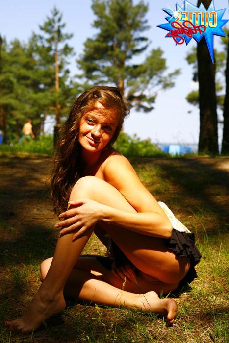 16P Gorgeous tart gets naked next to a crowded beach