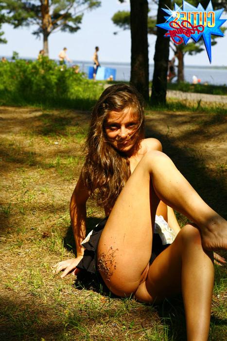 16P Gorgeous tart gets naked next to a crowded beach