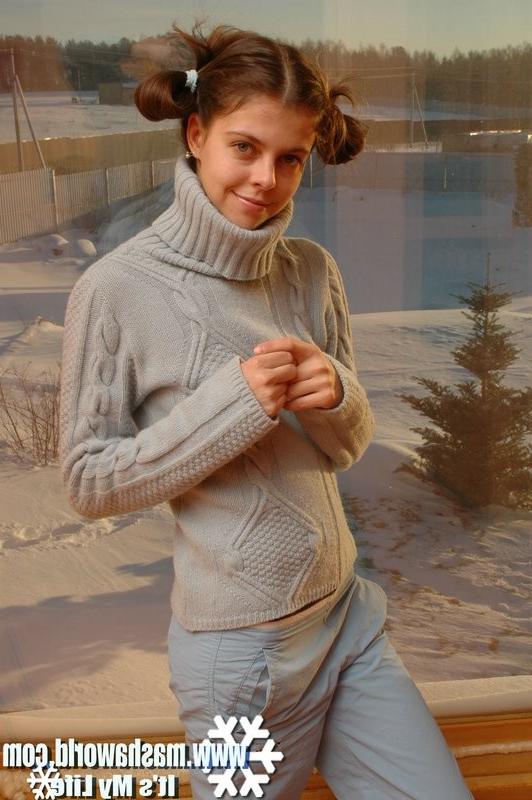 15P Sweet girl in front of a window