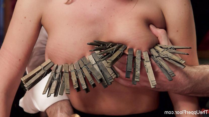 15P Fallon West smiles meekly with her face trapped in a strict posture collar. Her 