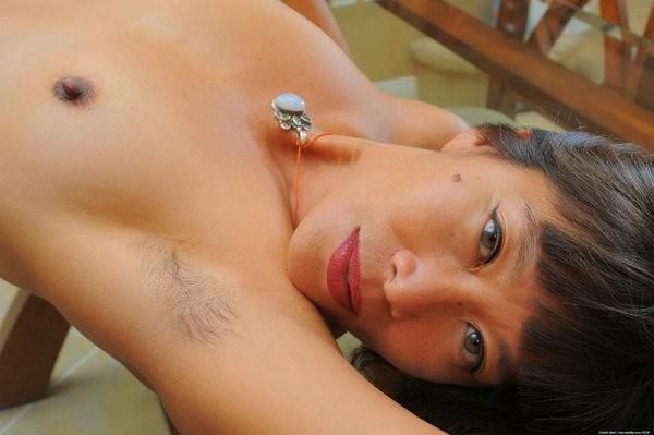 15P Asian Milf Sakura shows off her hairy muffin