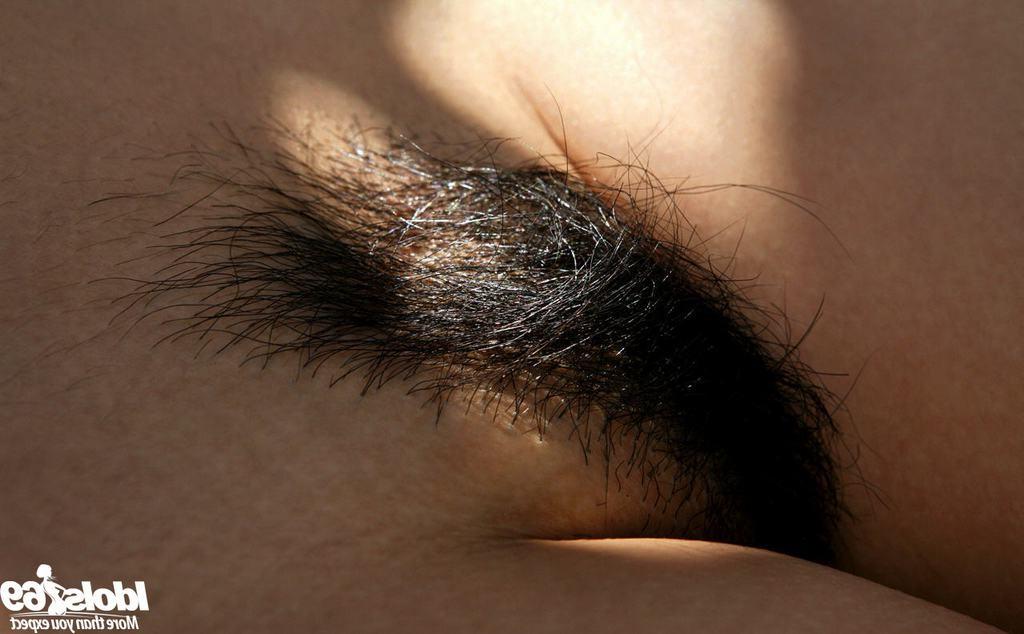 15P Beautiful Asian with perky tits shows her hairy pussy outdoors