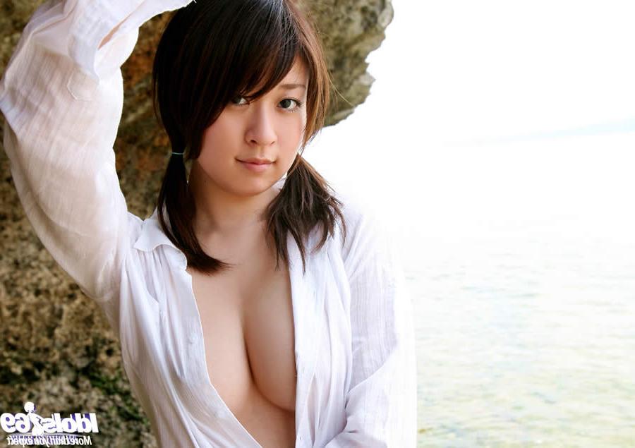 15P Cute japanese girl naked on a rocky beach