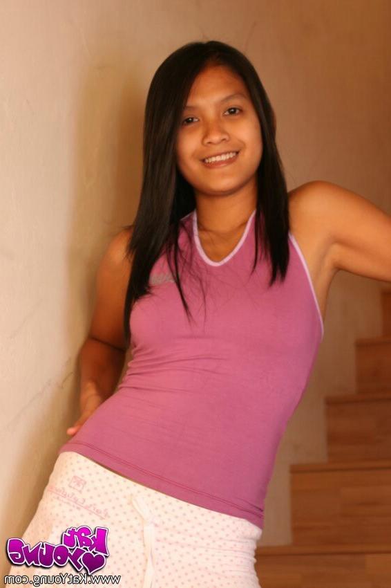 15P Kat Young posing on the stairs of her parents house