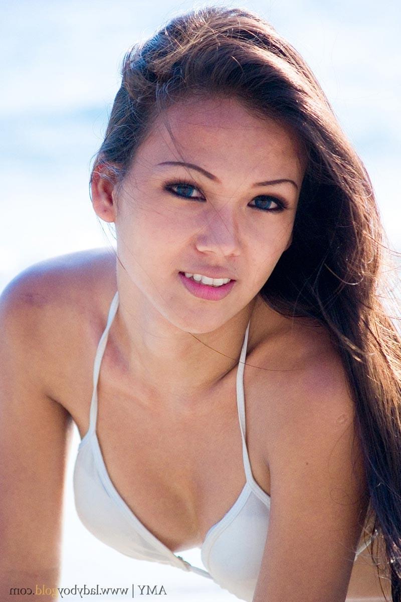 16P Asian ladyboy in bikini at beach