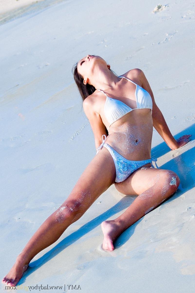 16P Asian ladyboy in bikini at beach