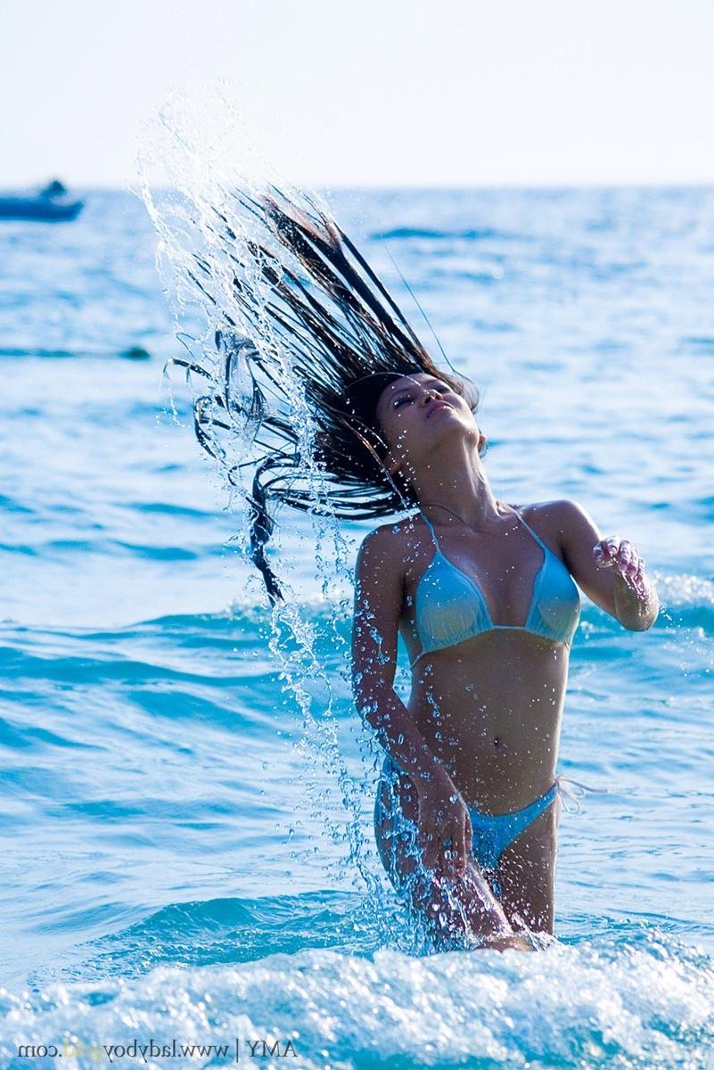 16P Asian ladyboy in bikini at beach