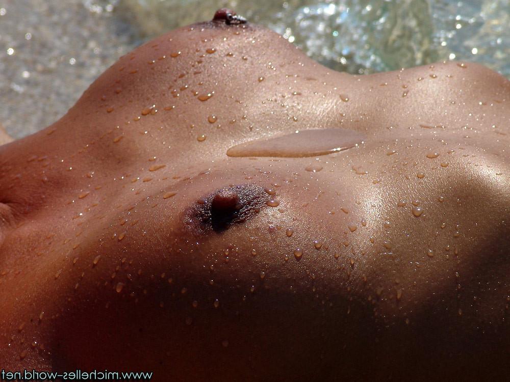 15P Dark tanned nude girl playing at the beach