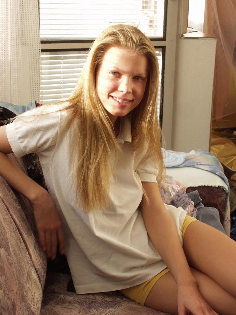 18P Barely legal blonde strips and poses in the window