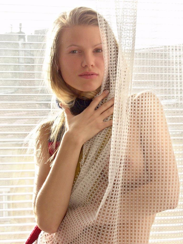 18P Barely legal blonde strips and poses in the window