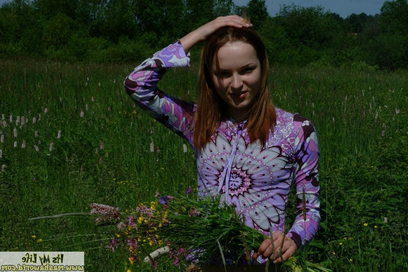 15P Two teen lesbians spread their lips in a field