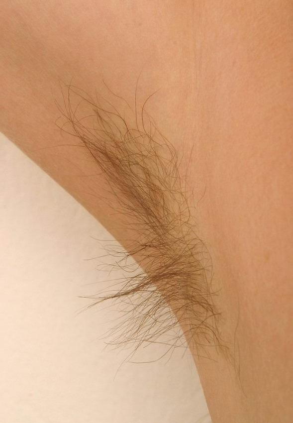15P redhead in glasses spreading her hairy pussy