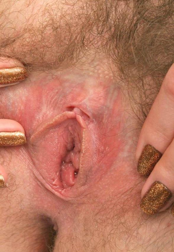 15P redhead in glasses spreading her hairy pussy