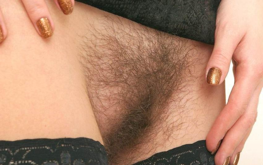 15P redhead in glasses spreading her hairy pussy