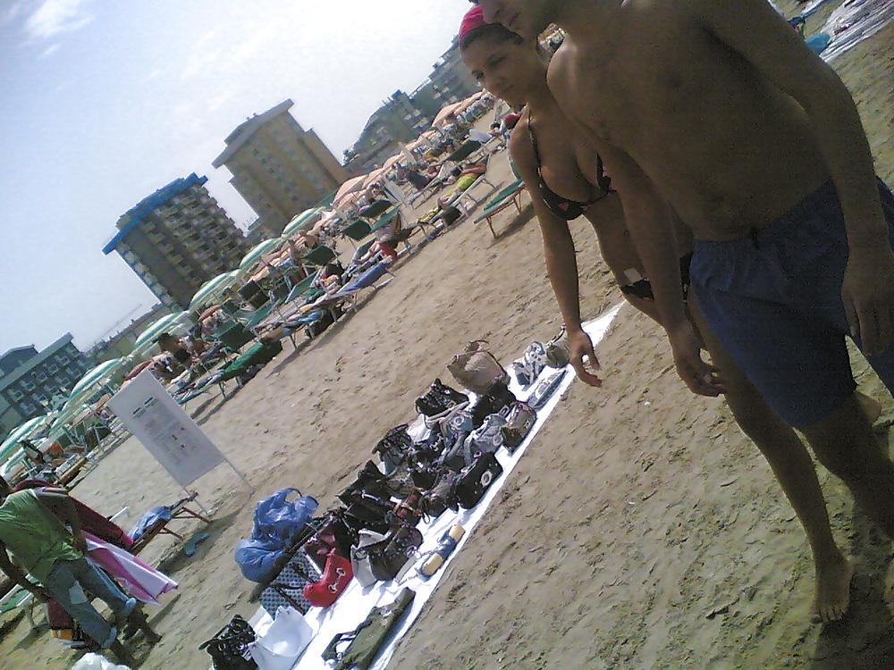 13P Slim and stacked girl on beach. Big natural boobs.