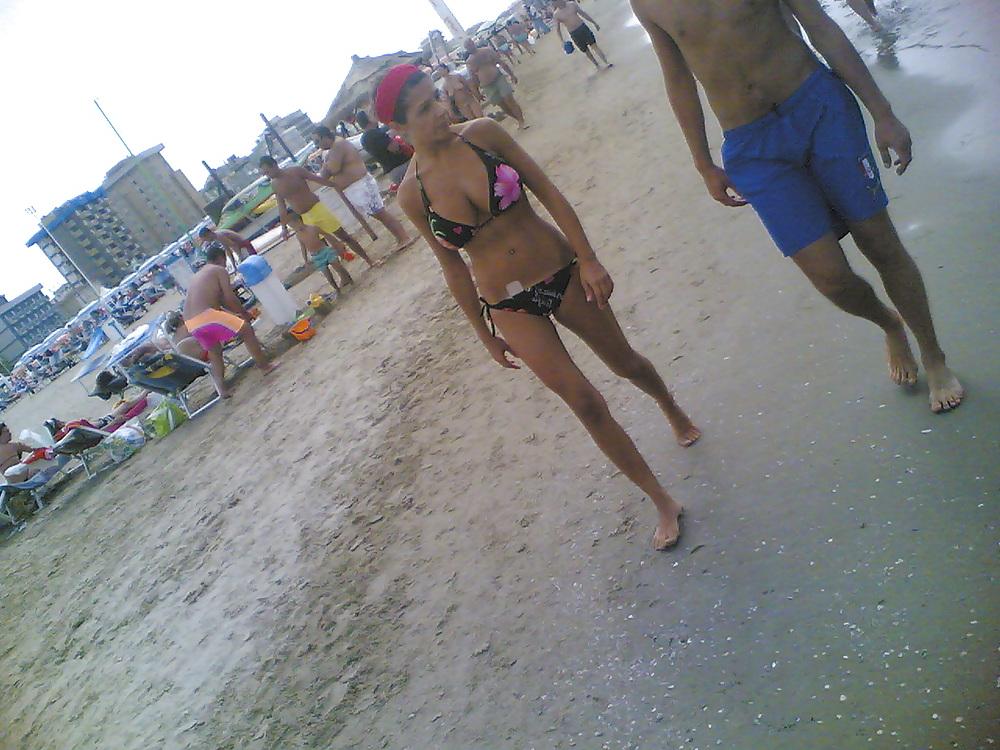 13P Slim and stacked girl on beach. Big natural boobs.
