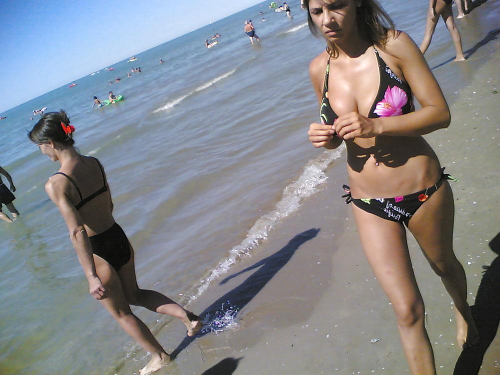 13P Slim and stacked girl on beach. Big natural boobs.