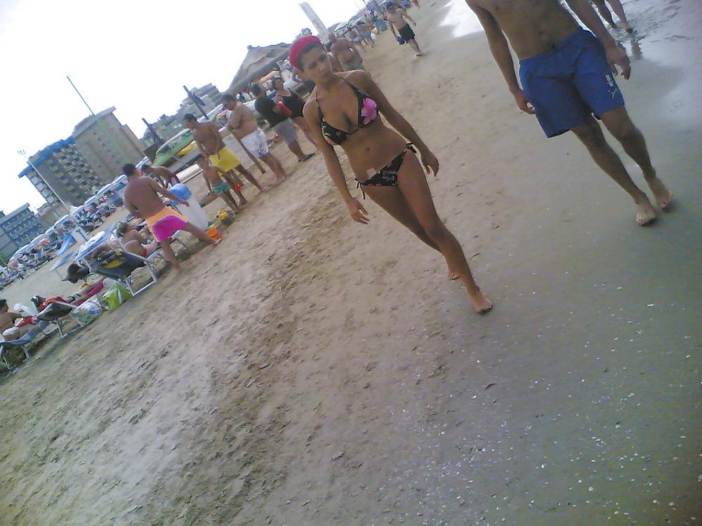 13P Slim and stacked girl on beach. Big natural boobs.