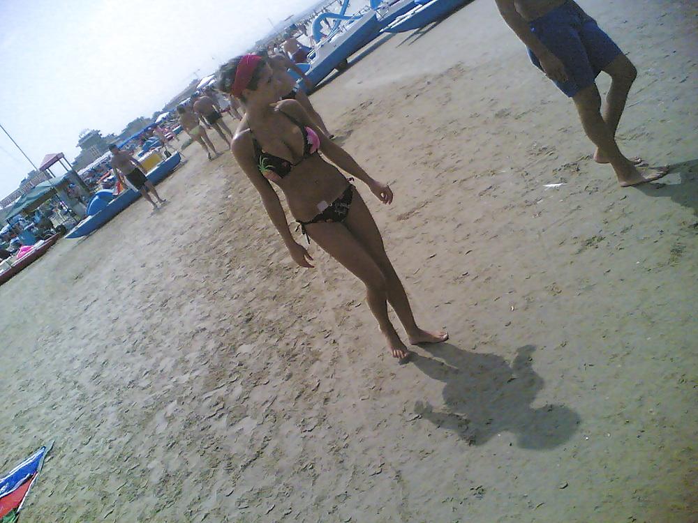 13P Slim and stacked girl on beach. Big natural boobs.