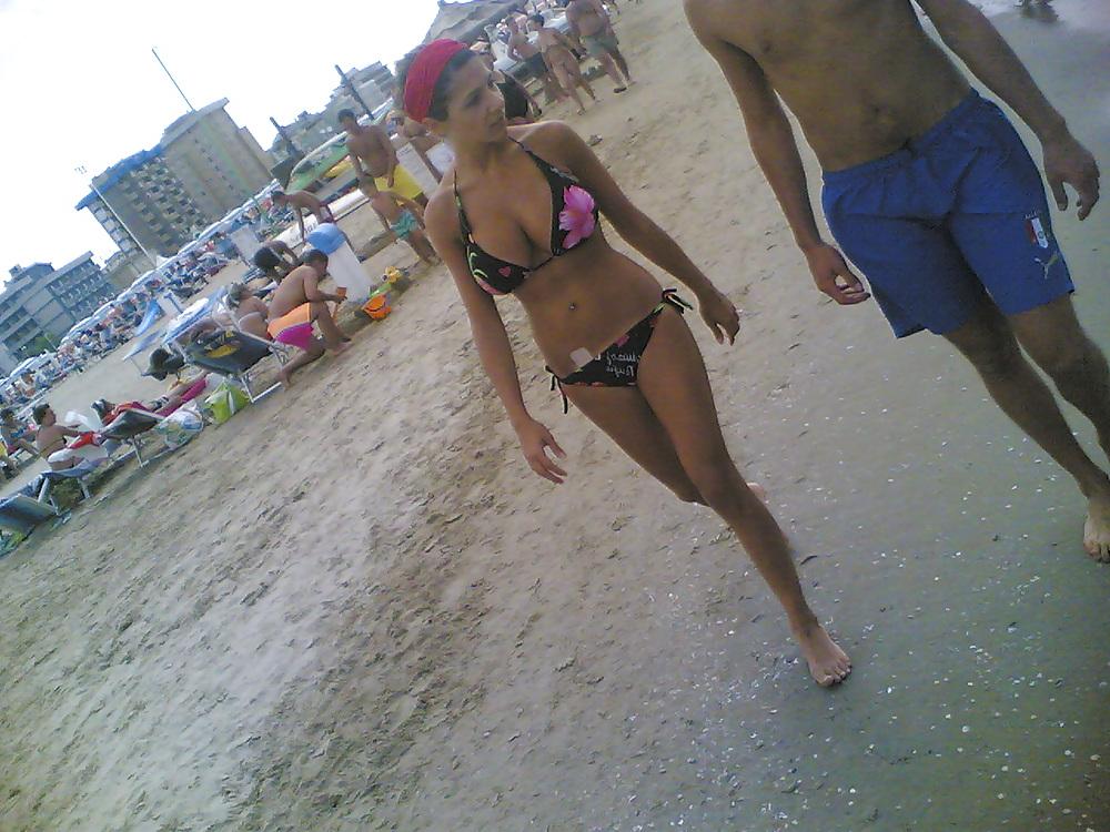 13P Slim and stacked girl on beach. Big natural boobs.