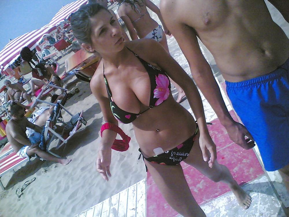 13P Slim and stacked girl on beach. Big natural boobs.