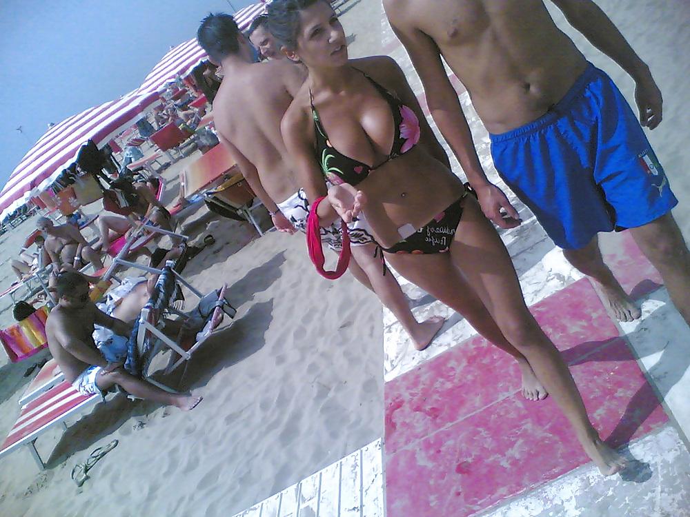 13P Slim and stacked girl on beach. Big natural boobs.