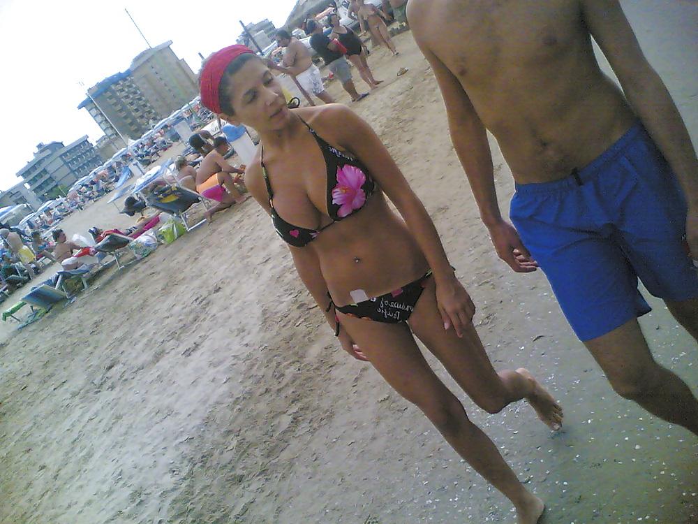 13P Slim and stacked girl on beach. Big natural boobs.