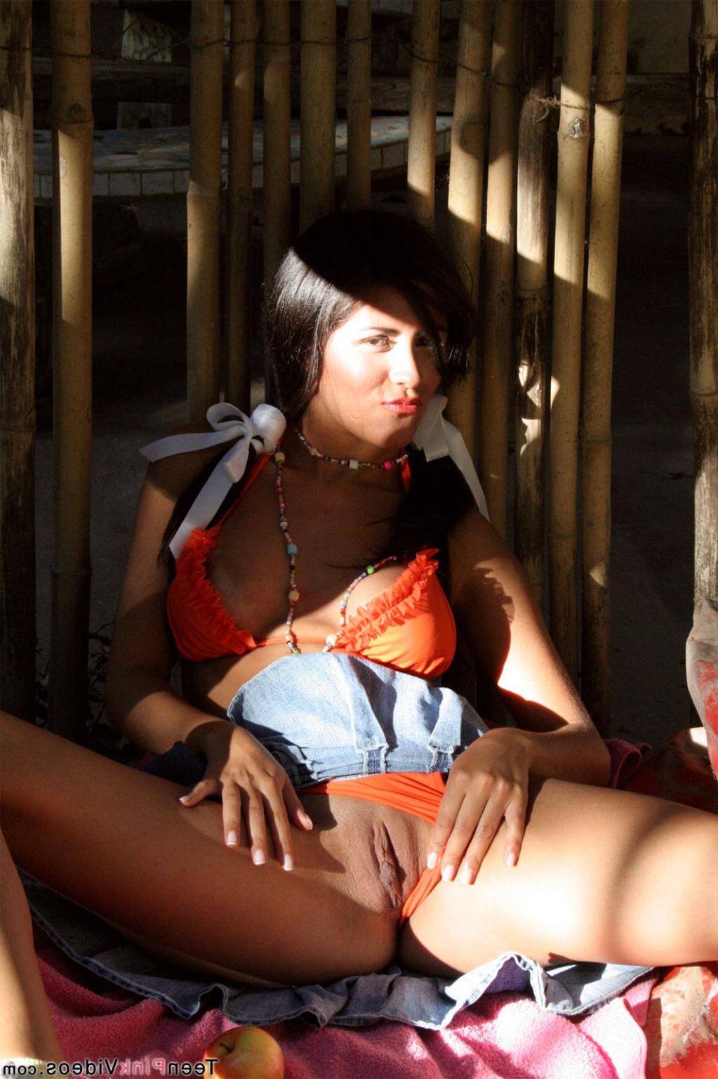 18P Isobel Riveria spreads her young pussy open outdoors.
